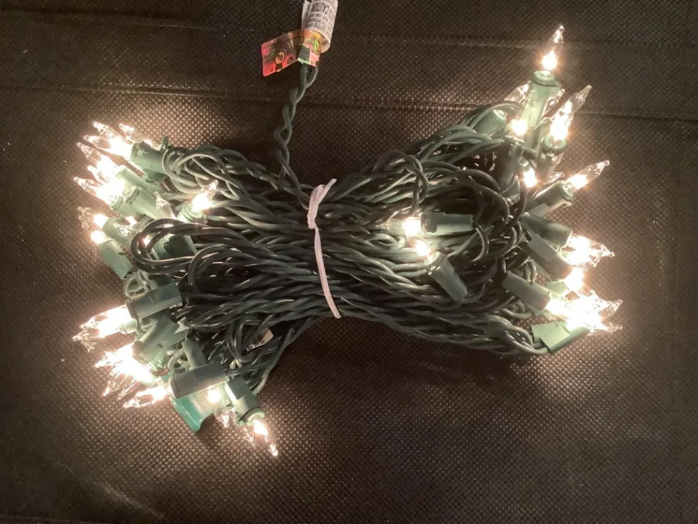 clear_white_incandescent__light_set_green_wire_1.webp Flash Sale A Christmas Clear White Incandescent 100 Light Set, Green Wire